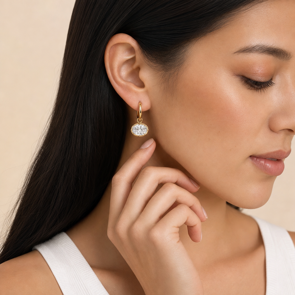 East West Diamond Oval Drop earring in gold, worn