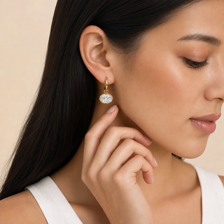 East West Diamond Oval Drop earring in gold, worn